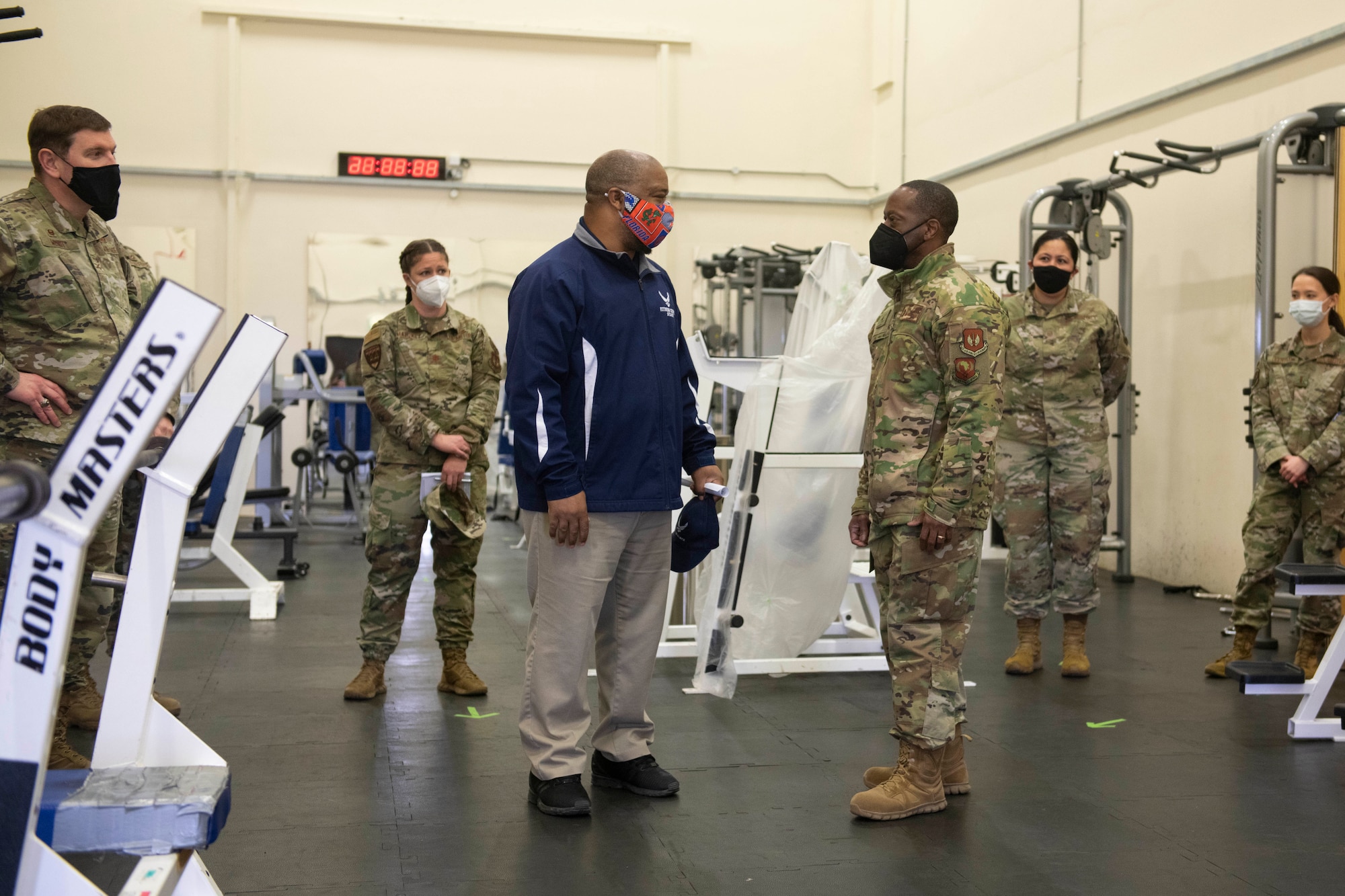 Marcel Gibson, center left, 423rd Force Support Squadron fitness and sports manager, briefs Brig. Gen. Ronald E. Jolly Sr., center right, U.S. Air Forces in Europe and Air Forces Africa logistics, engineering and force protection director, about the renovation changes at the Royal Air Force Molesworth Fitness Center Annex, England, March 10, 2021. The 501st CSW hosted an immersion tour for Jolly and his leadership team, demonstrating the mission set and capabilities of several organizations including the security forces, logistics readiness and civil engineer squadrons. (U.S. Air Force photo by Senior Airman Jennifer Zima)