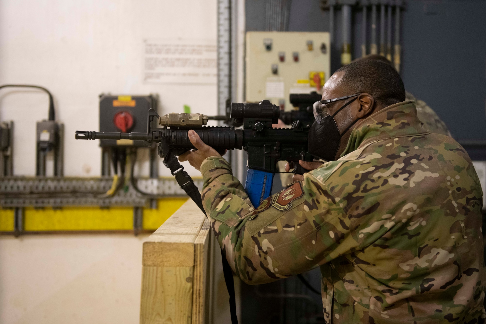 U.S. Air Force Brig. Gen. Ronald E. Jolly Sr., U.S. Air Forces in Europe and Air Forces Africa logistics, engineering and force protection director, shoots an M4 carbine during a visit to the Royal Air Force Molesworth, England, March 10, 2021. The 501st CSW hosted an immersion tour for Jolly and his leadership team, demonstrating the mission set and capabilities of several organizations including the security forces, logistics readiness and civil engineer squadrons. (U.S. Air Force photo by Senior Airman Jennifer Zima)