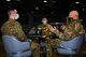 U.S. Space Force Gen. John W. “Jay” Raymond, Chief of Space Operations, talks to Sgt. Jacob Varner, a 354th Communications Squadron vulnerability hunt specialist, left, and Specialist 3 Richard Hayden, a 354th Range Squadron radio frequency transmission journeyman, on Eielson Air Force Base, Alaska, March 10, 2021.