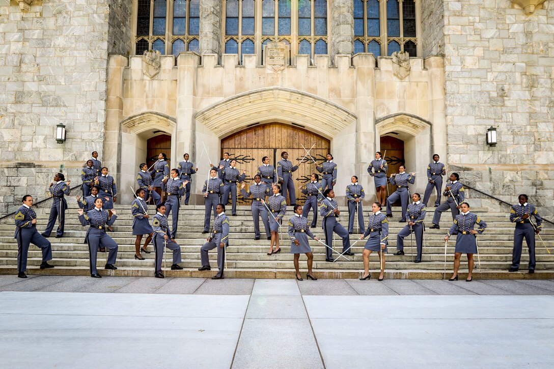 Women cadets stand on the steps of a building at West Point, N.Y.