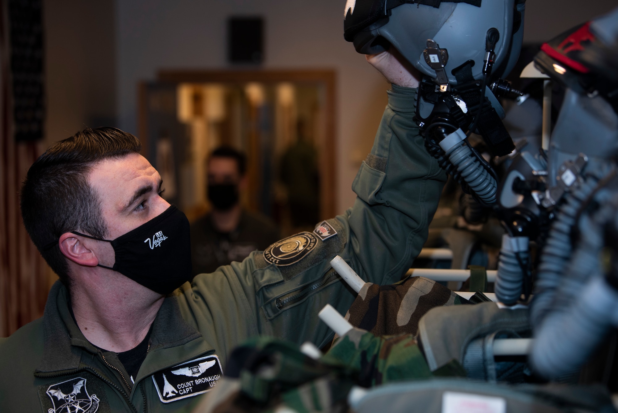 A 9th Expeditionary Bomb Squadron pilot grabs aircrew flight equipment at Ørland Air Force Station, Norway, March 8, 2021. Four 9th EBS B-1B Lancer aircrew participated in Agile Condor, a Bomber Task Force Europe training mission that marked the first time that B-1’s have landed within the Arctic Circle. (U.S. Air Force photo by Airman 1st Class Colin Hollowell)