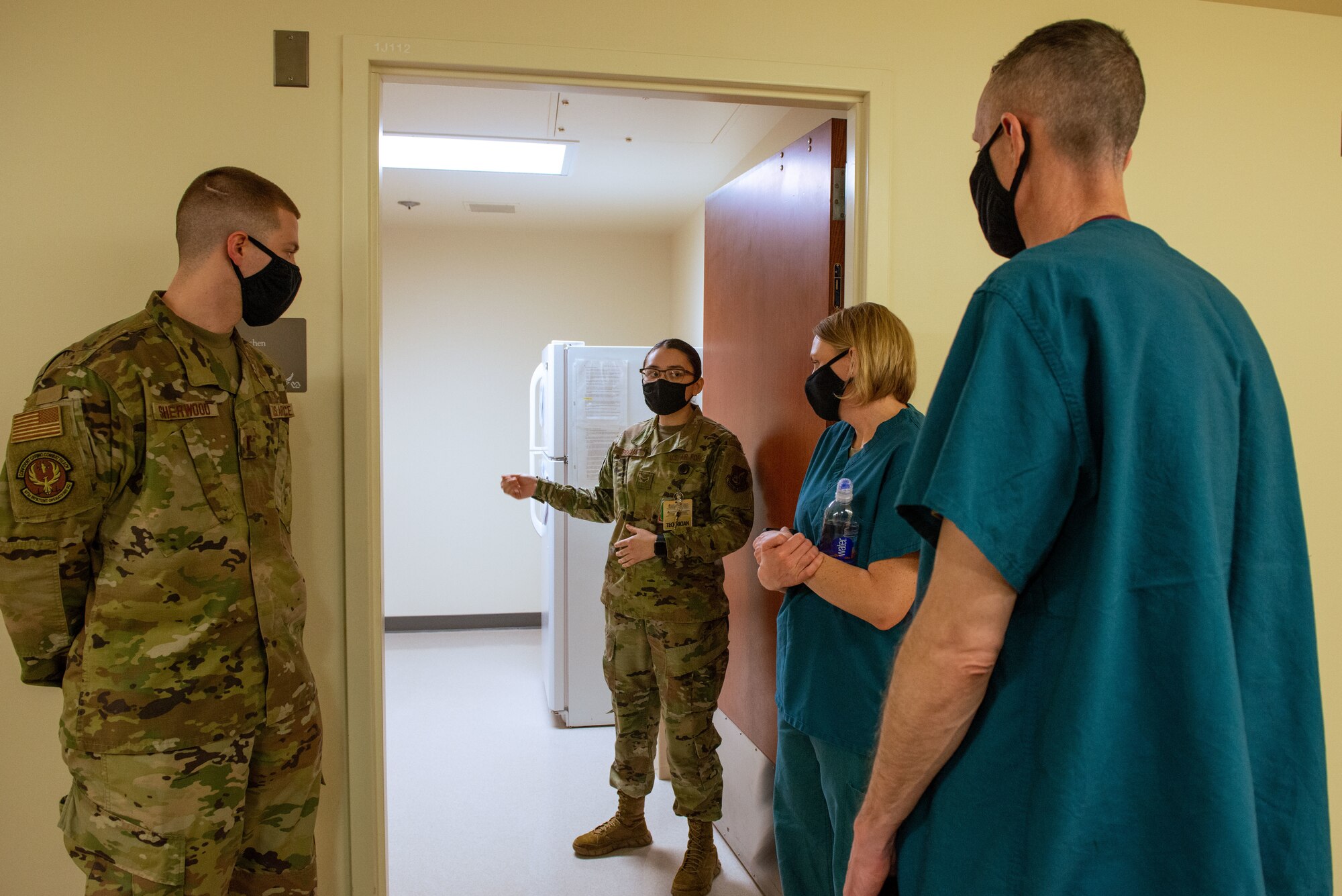 U.S. Air Force Airman 1st Class Jaqueline Rocha, second from left, 673d Inpatient Operations Squadron mental health technician, and 2nd Lt. John Sherwood, left, 673d IPTS mental health nurse, brief U.S. Air Force Col. Kirsten Aguilar, second from right, Joint Base Elmendorf-Richardson and 673d Air Base Wing commander, and U.S. Air Force Chief Master Sgt. Lee Mills, JBER and 673d ABW command chief, during a 673d IPTS immersion at JBER, Alaska, Feb. 26, 2021. The tour familiarized base leadership with the 673d IPTS and its role in supporting readiness. The 673d IPTS provides a full range of medical care to include perinatal care, intensive care, and behavioral health services to JBER and the greater Anchorage area.