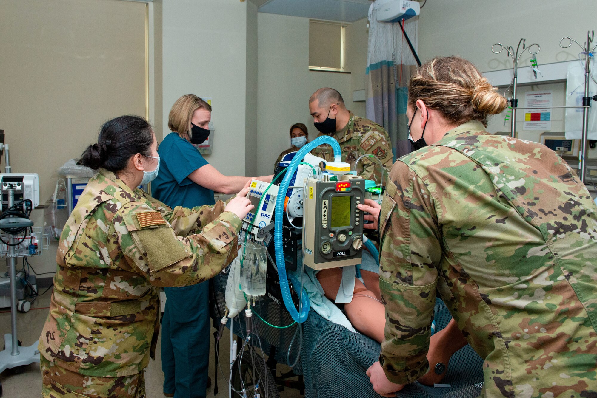 U.S. Air Force Col. Kirsten Aguilar, second from left, Joint Base Elmendorf-Richardson and 673d Air Base Wing commander, and the 673d Medical Group’s Critical Care Air Transport Team practice treating a pneumothorax on a dummy in a simulated in-flight environment using a transport ventilator during a 673d Inpatient Operations Squadron immersion at Joint Base Elmendorf-Richardson, Alaska, Feb. 26, 2021. The tour familiarized base leadership with the 673d IPTS and its role in supporting readiness. The 673d IPTS provides a full range of medical care to include perinatal care, intensive care, and behavioral health services to JBER and the greater Anchorage area.