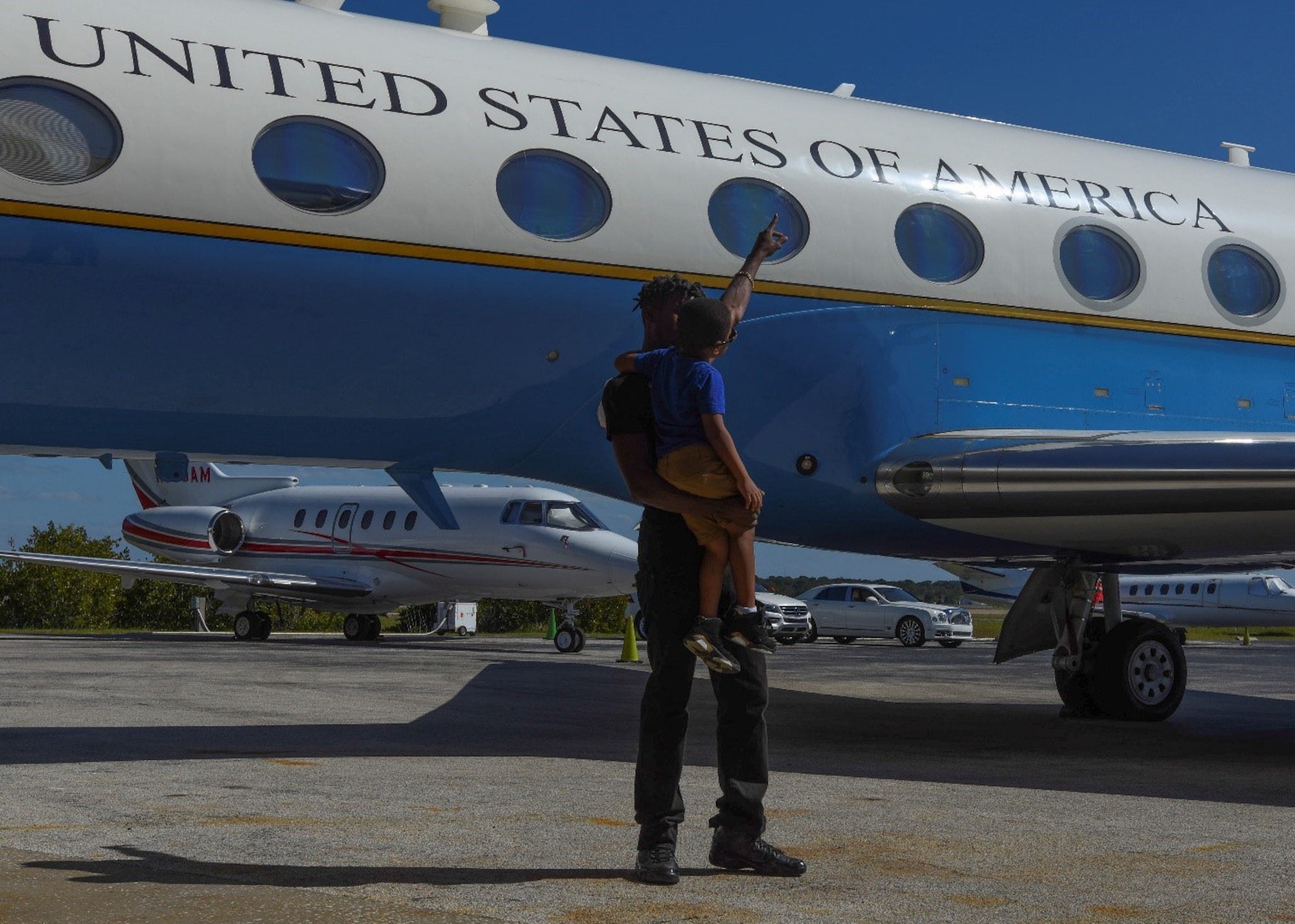 Jauhar El-Amin and his son, Saint El-Amin, age 8, checkout a C-37B Gulfstream aircraft during 89th Airlift Wing African American Heritage Flight’s stop at Clearwater, Fla., Sunday, Feb. 21, 2021.