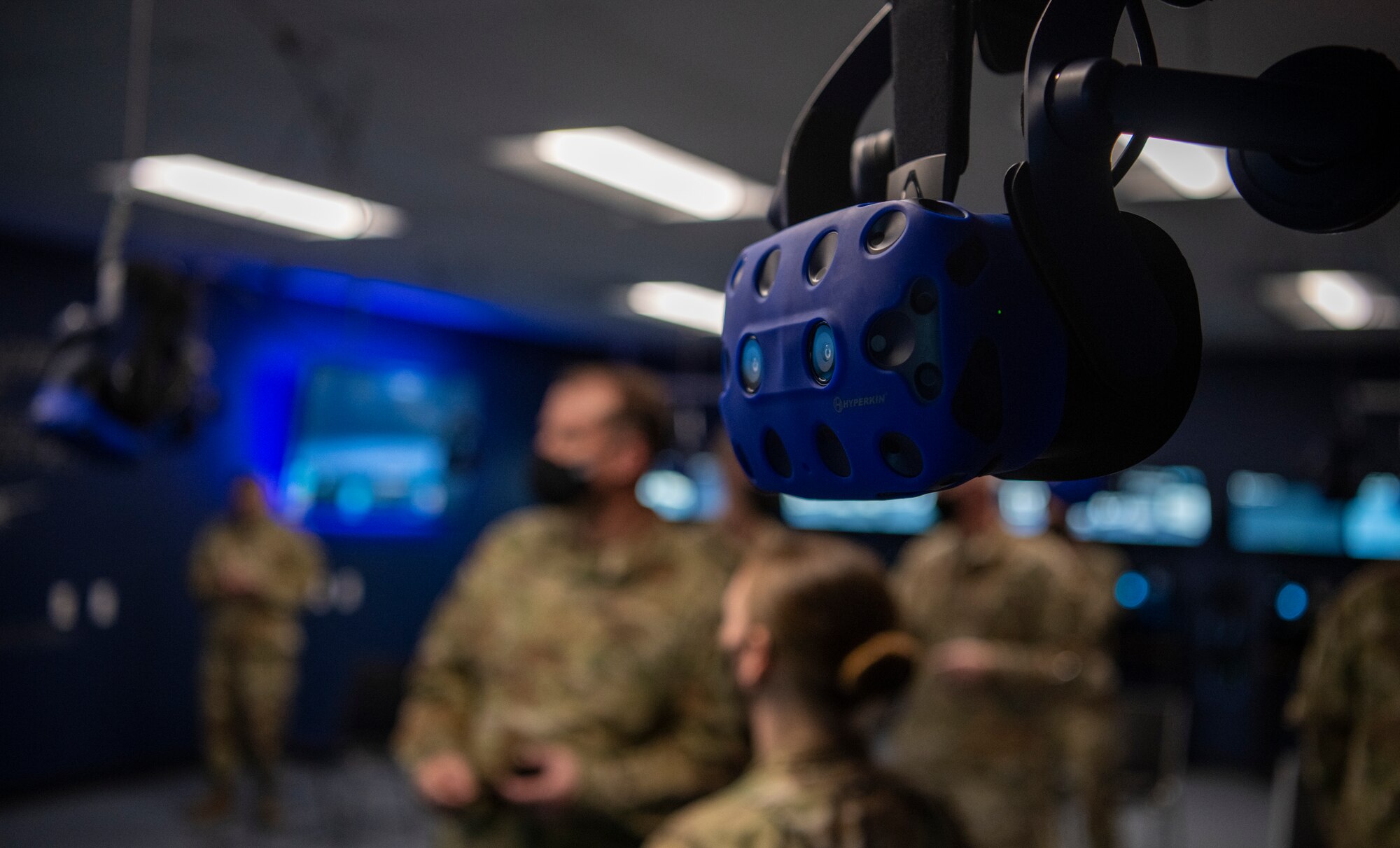 A virtual reality headset hangs from the ceiling at the 317th Maintenance Group VR lab at Dyess Air Force Base, Texas, Mar. 3, 2021.