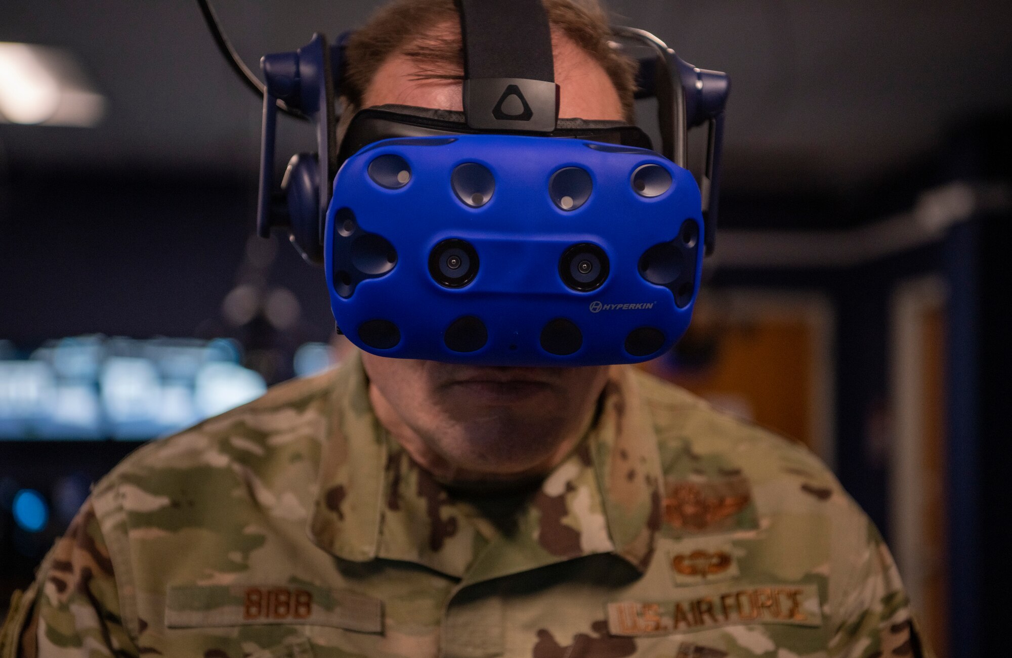 Maj. Gen. Thad Bibb, 18th Air Force commander, looks through a virtual reality headset at Dyess Air Force Base, Texas, Mar. 3, 2021.