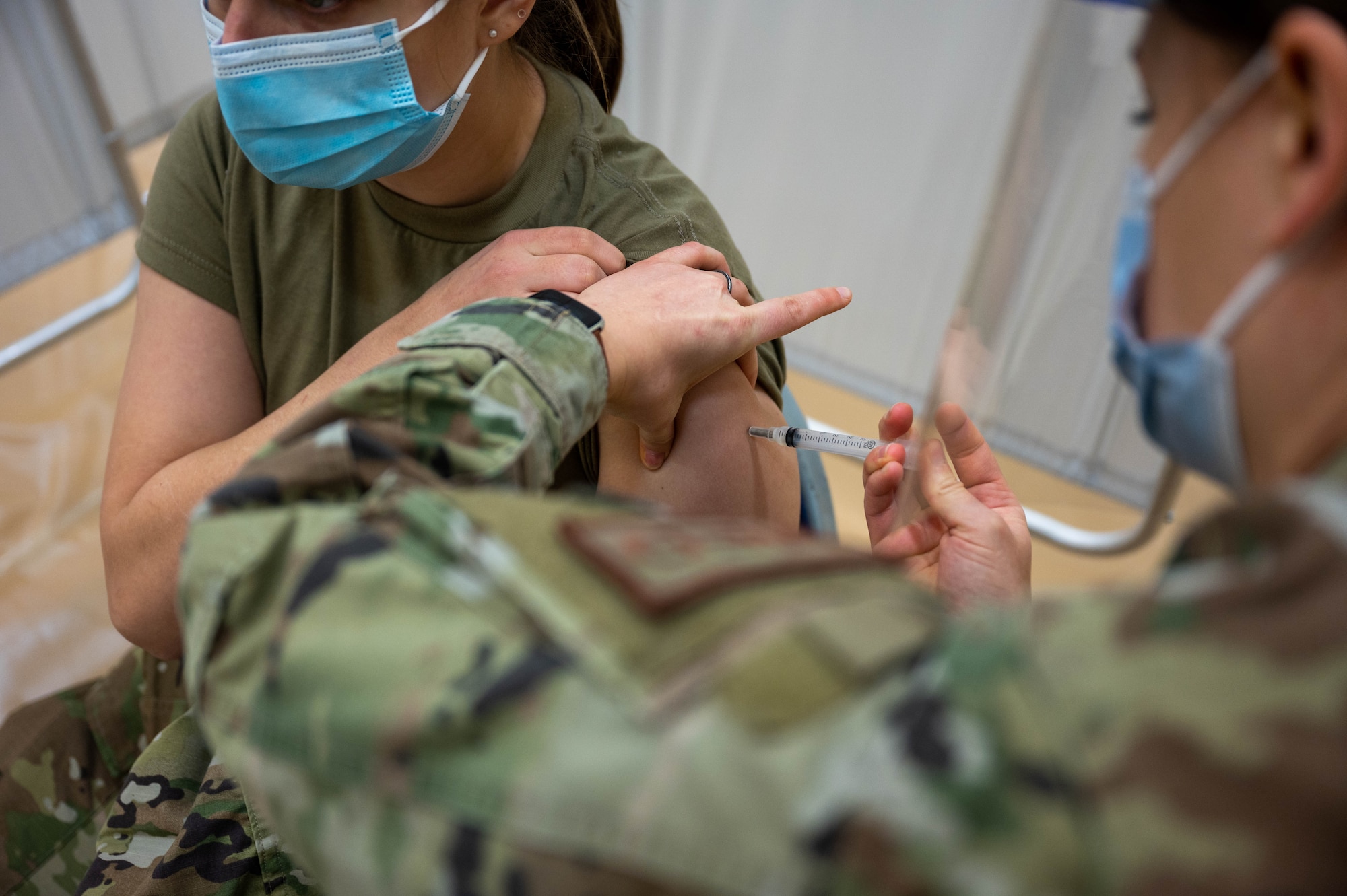 An Airman from the 934th Airlift Wing waits in the observation area after receiving the COVID-19 vaccine at the Minneapolis-St. Paul Air Reserve Station, March 7, 2021. The observation area keeps Airmen for 15 minutes after they receive their shot to ensure no immediate symptoms arise that could require care. (U.S. Air Force photo by Tech. Sgt. Trevor Saylor)
