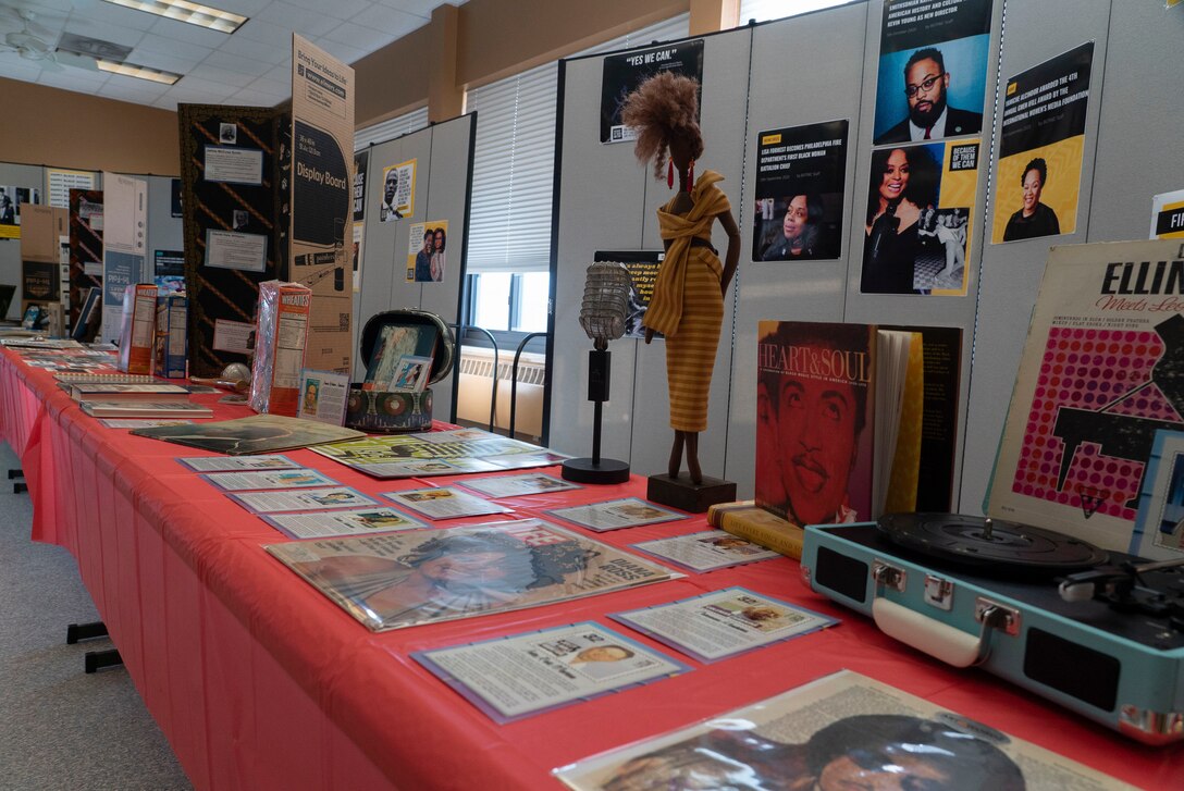 Photos and artifacts rest on a table in the Prairie Rose Chapel.