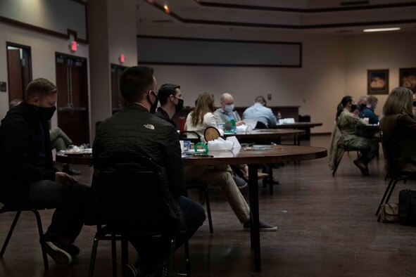 a sign is in front of a projector screen