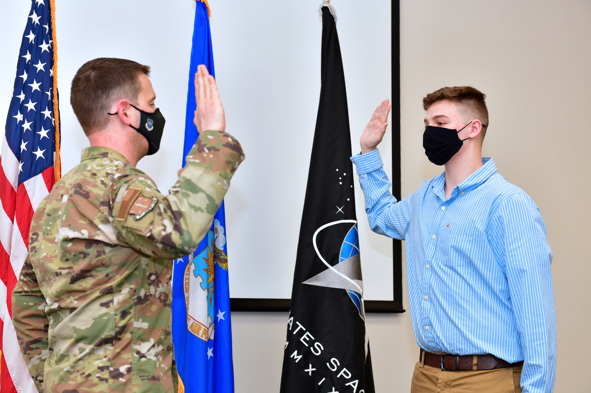 A person recites the Oath of Enlistment