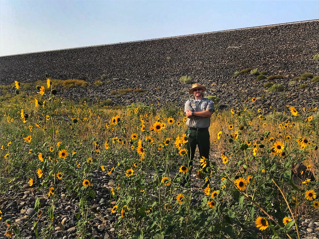 COCHITI LAKE, N.M. – Park Ranger Wesley Myers stands in the native garden area he has been working on at the lake, Sept. 19, 2020. Myers plotted the land, added soil, and seeded it to attract native bees.
