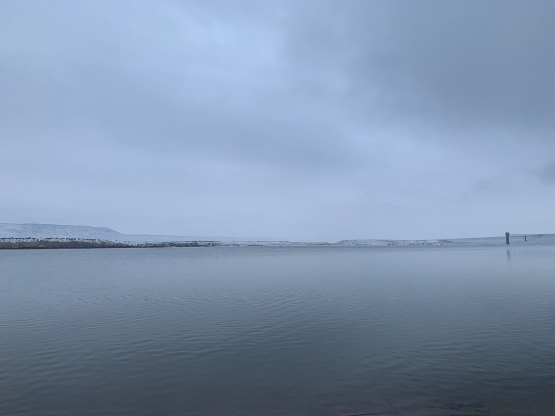 COCHITI LAKE, N.M. – The lake and dam the morning after a snowstorm, February 2021.