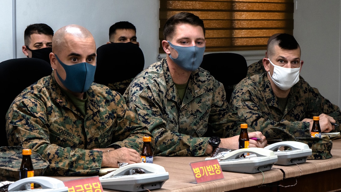 U.S. Marines from 3rd Battalion, 3rd Marine Regiment, 3rd Marine Division, listen to Republic of Korea (ROK) Marines with 2nd Battalion, 3rd Marine Brigade, 1st ROK Marine Division (ROKMARDIV), answering a question regarding safety prior to a site survey of multiple training areas for Korean Marine Exchange Program 21-2 (KMEP 21-2) at the 1st ROKMARDIV Base, Pohang, ROK March 8, 2021. U.S. Marines from 3rd Battalion, 3rd Marine Regiment conducted a site survey with ROK Marines from 2nd Battalion, 3rd Marine Brigade of multiple training areas located around the city of Pohang where KMEP 21-2 will be held. (U.S. Marine Corps photo by Cpl. Ryan H. Pulliam)