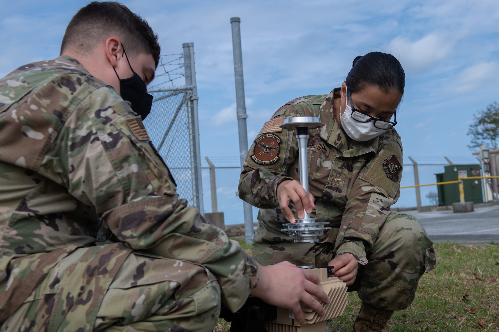 18th CS assembles a VSAT satellite.