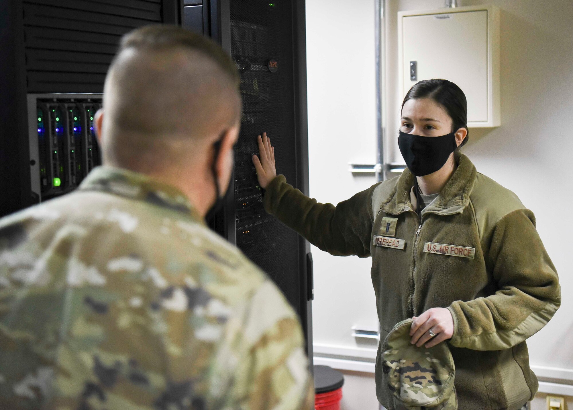 U.S. Air Force 1st Lt. Tiffanie Morehead, the 35th Medical Support Squadron medical systems information flight commander, describes the Medical Community of Interest (Med-COI) server to Col. Jesse Friedel, the 35th Fighter Wing commander, during a Wild Weasel Walk-Through in the medical facility at Misawa Air Base, March 9, 2021.