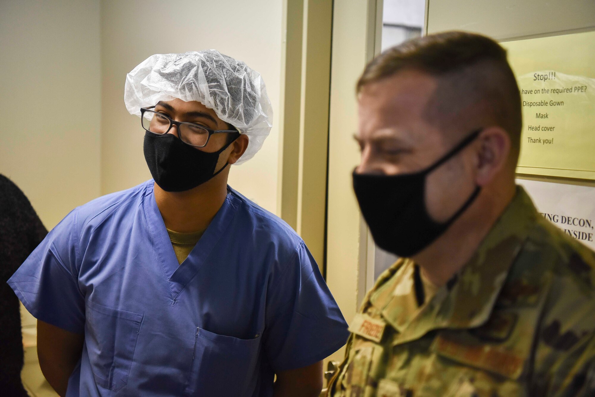 U.S. Air Force Col. Jesse Friedel, the 35th Fighter Wing commander, meets with Airman 1st Class Sudipto Das, a 35th Surgical Unit surgical technician, during a Wild Weasel Walk-Through of the medical facility at Misawa Air Base, March 9, 2021.