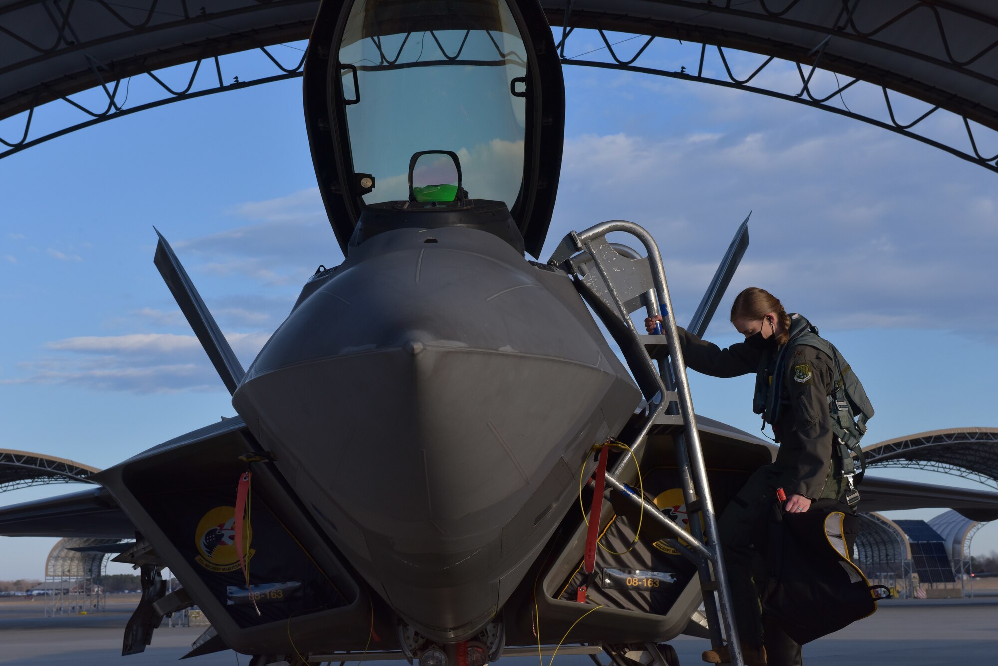 Pilot climbs into F-22 Raptor