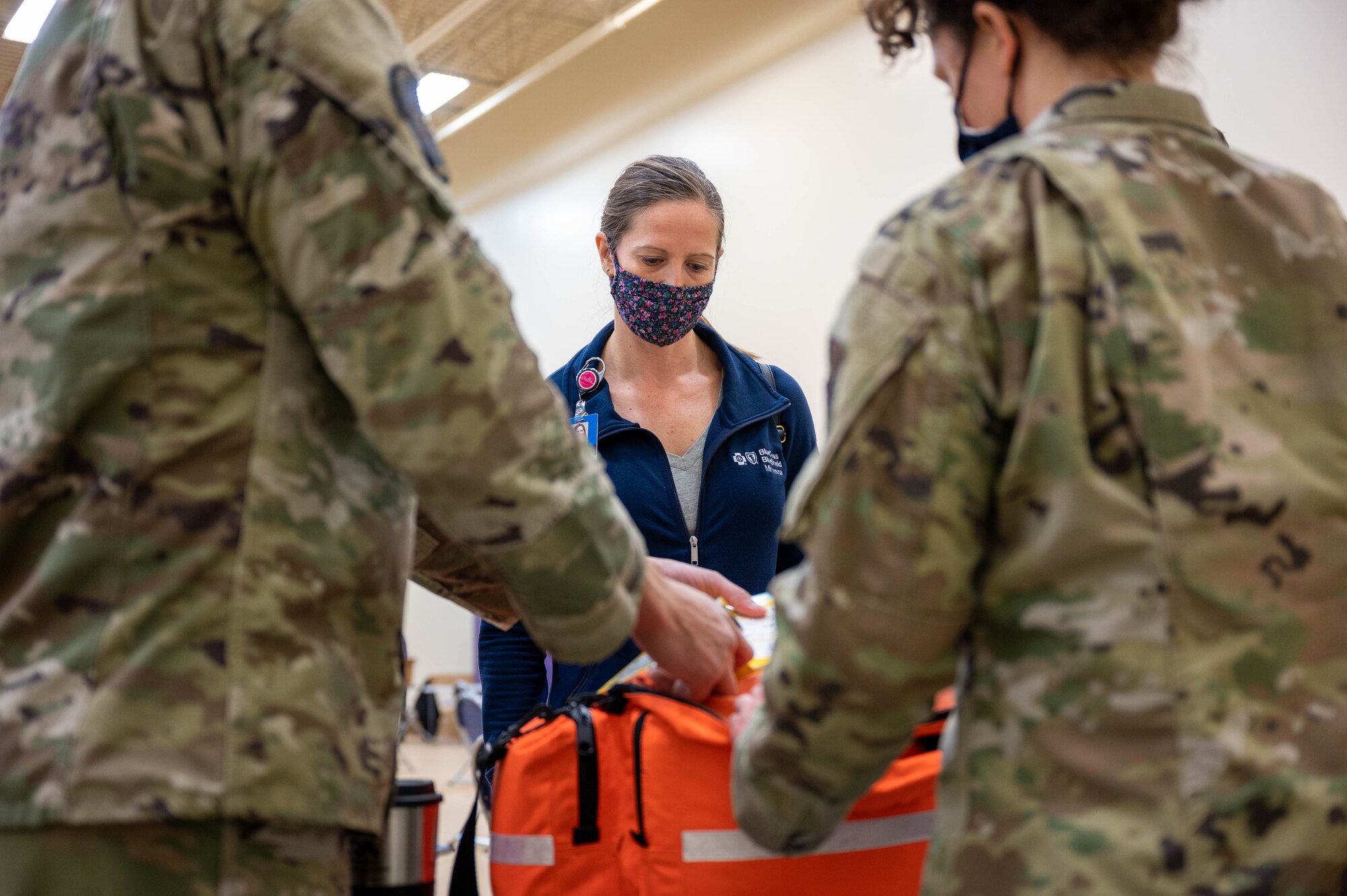 An Airman from the 934th Airlift Wing waits in the observation area after receiving the COVID-19 vaccine at the Minneapolis-St. Paul Air Reserve Station, March 7, 2021. The observation area keeps Airmen for 15 minutes after they receive their shot to ensure no immediate symptoms arise that could require care. (U.S. Air Force photo by Tech. Sgt. Trevor Saylor)