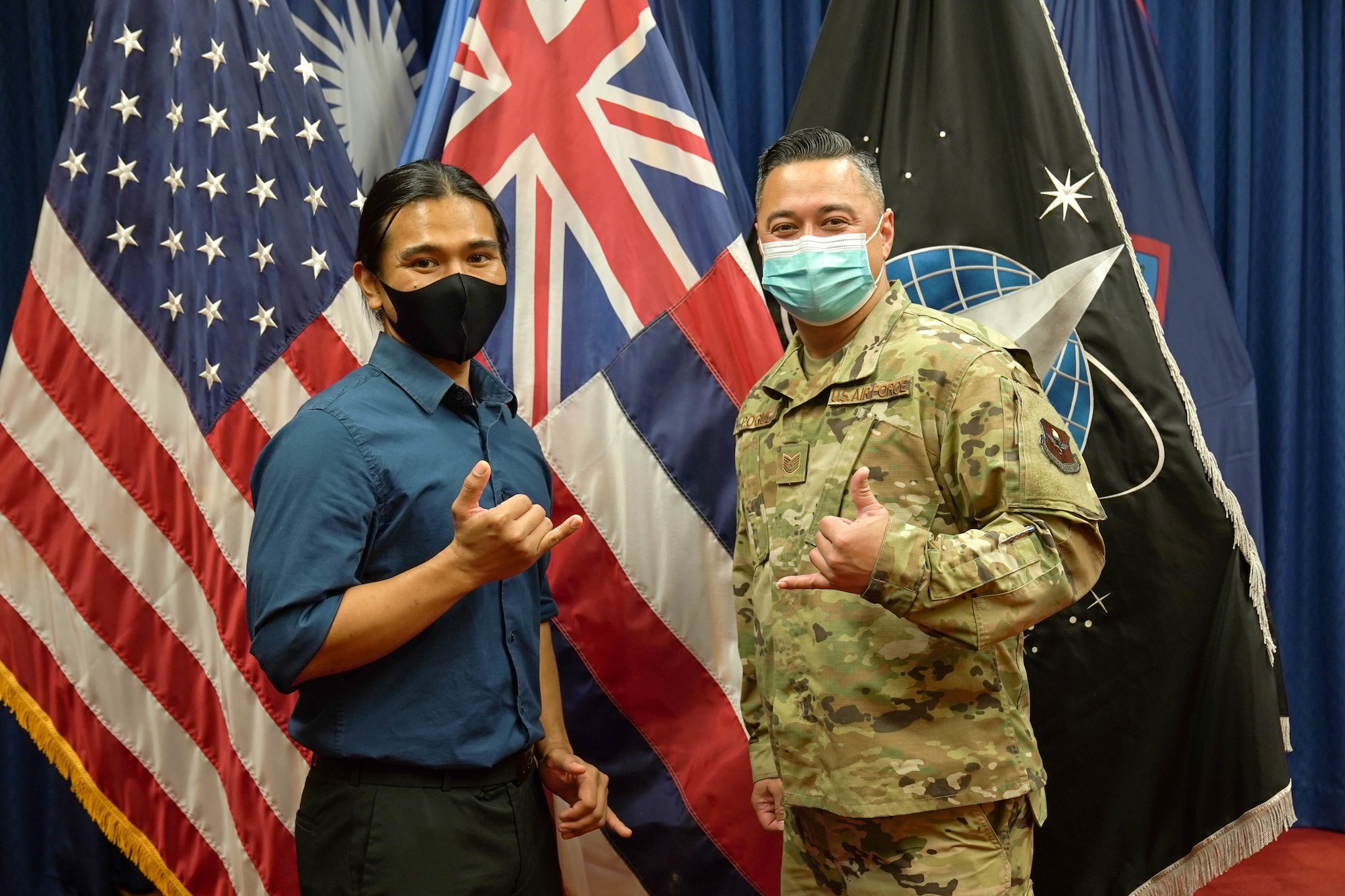 Reyjie Cliff Blando Madriaga, U.S. Space Force recruit, and his recruiter, U.S. Air Force Tech. Sgt. Shiloh Pogue, Pacific Operations Recruiter, after completing the oath of enlistment at Joint Base Pearl Harbor-Hickam, Hawaii, March 4, 2021. Madriaga, born and raised in Hawaii, is the first Hawaiian U.S. Space Force Recruit to swear into the Delayed Entry Program at Honolulu Military Entrance Processing Center.  (U.S. Air Force photo by Airman 1st Class Makensie Cooper)