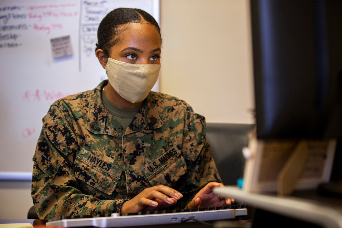 U.S. Marine Corps Sgt. Jerre’al Hayles, a Pacific trial team paralegal with the Legal Service Support Section, works on special notification procedures at her desk on Camp Foster, Okinawa, Japan, March 10, 2021. Hayles won the 2020 Trial Service Office Marine of the Year award for going above and beyond the expectations and duties within the unit. Hayles is a native of Smithfield, Virginia. (U.S. Marine Corps photo by Cpl. Karis Mattingly)