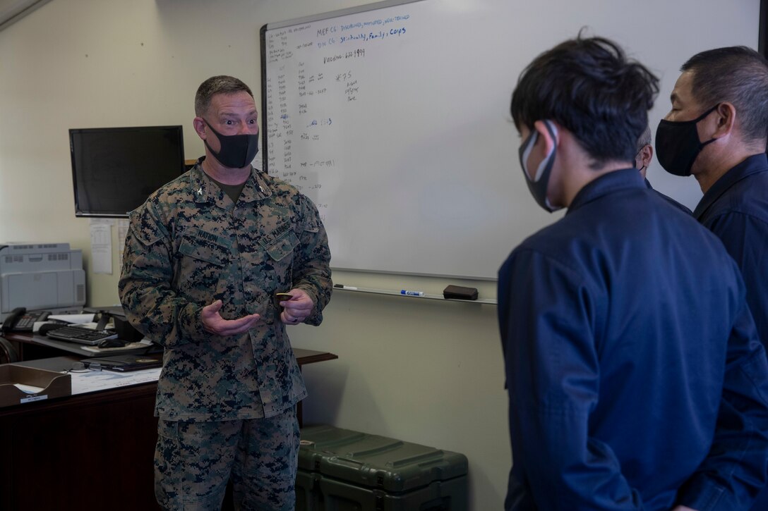 U.S. Marine Corps Col. Matthew Nation, the commanding officer of Headquarters Battalion 3d Marine Division, gives his remarks to Japanese Security Guards (JSG) on Camp Courtney, Okinawa, Japan, March 10, 2021. JSG was presented with challenge coins to highlight their efforts after protecting the installation by stopping an unauthorized intruding vehicle. (U.S. Marine Corps photo by Lance Cpl. Zachary Larsen)