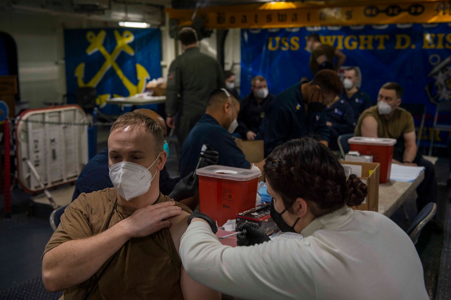 210311-N-MW930-1013 MEDITERRANEAN SEA (March 11, 2021) Sailors receive a second dose of the COVID-19 vaccination aboard the Nimitz-class aircraft carrier USS Dwight D. Eisenhower (CVN 69), in the Mediterranean Sea, March 11, 2021. The IKE Carrier Strike Group is on a scheduled deployment in the U.S. Sixth Fleet area of operations in support of U.S. national interests and security in Europe and Africa.