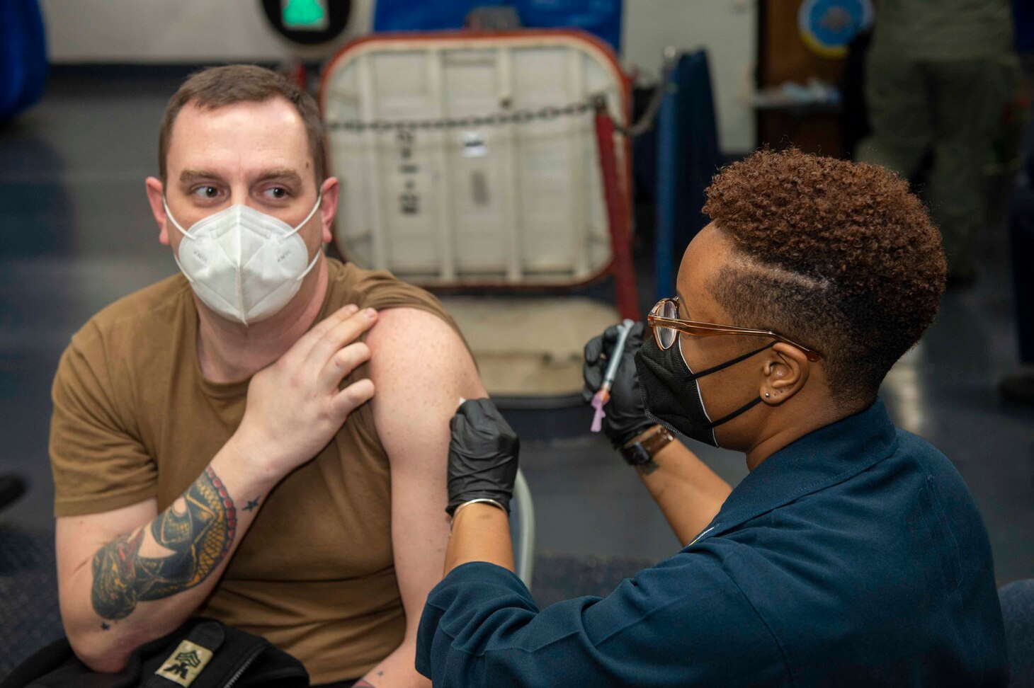 210311-N-MW930-1013 MEDITERRANEAN SEA (March 11, 2021) Sailors receive a second dose of the COVID-19 vaccination aboard the Nimitz-class aircraft carrier USS Dwight D. Eisenhower (CVN 69), in the Mediterranean Sea, March 11, 2021. The IKE Carrier Strike Group is on a scheduled deployment in the U.S. Sixth Fleet area of operations in support of U.S. national interests and security in Europe and Africa.