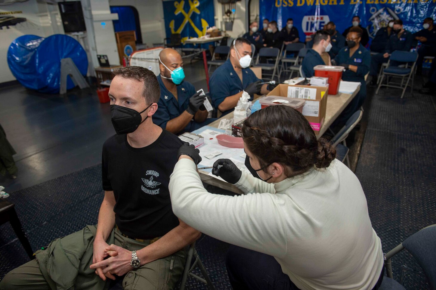 210311-N-MW930-1013 MEDITERRANEAN SEA (March 11, 2021) Sailors receive a second dose of the COVID-19 vaccination aboard the Nimitz-class aircraft carrier USS Dwight D. Eisenhower (CVN 69), in the Mediterranean Sea, March 11, 2021. The IKE Carrier Strike Group is on a scheduled deployment in the U.S. Sixth Fleet area of operations in support of U.S. national interests and security in Europe and Africa.