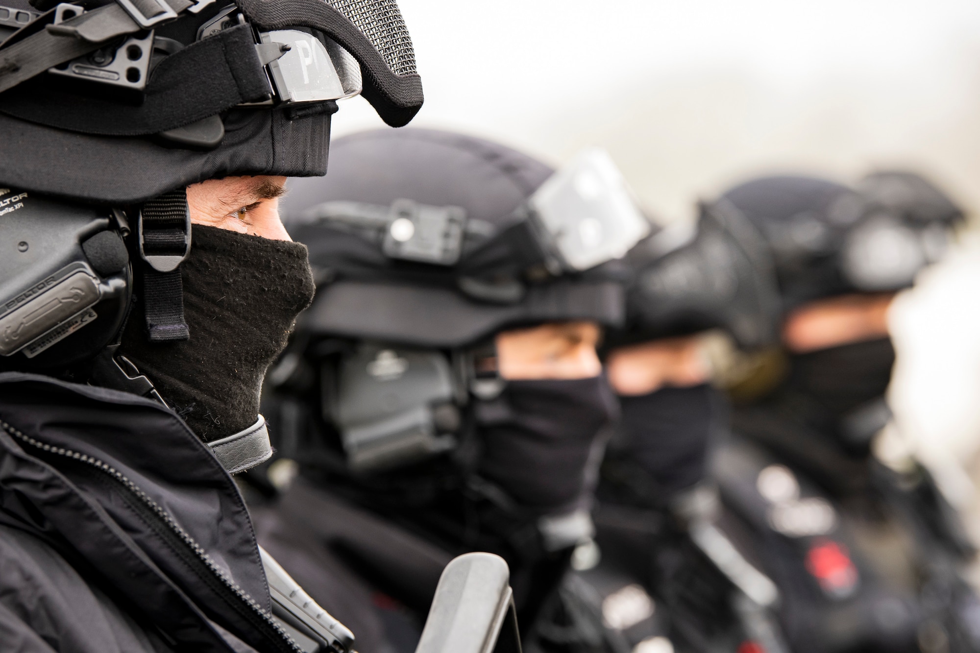 Policemen, from the Northamptonshire Police Department, stand in formation prior to a field training exercise at RAF Croughton, England, Mar. 3, 2021. The NHPD utilized the 422d Security Forces Squadron training complex to help strengthen their tactics and techniques. Events like this help strengthen the local partnership between the 422d SFS and the NHPD. (U.S. Air Force photo by Senior Airman Eugene Oliver)