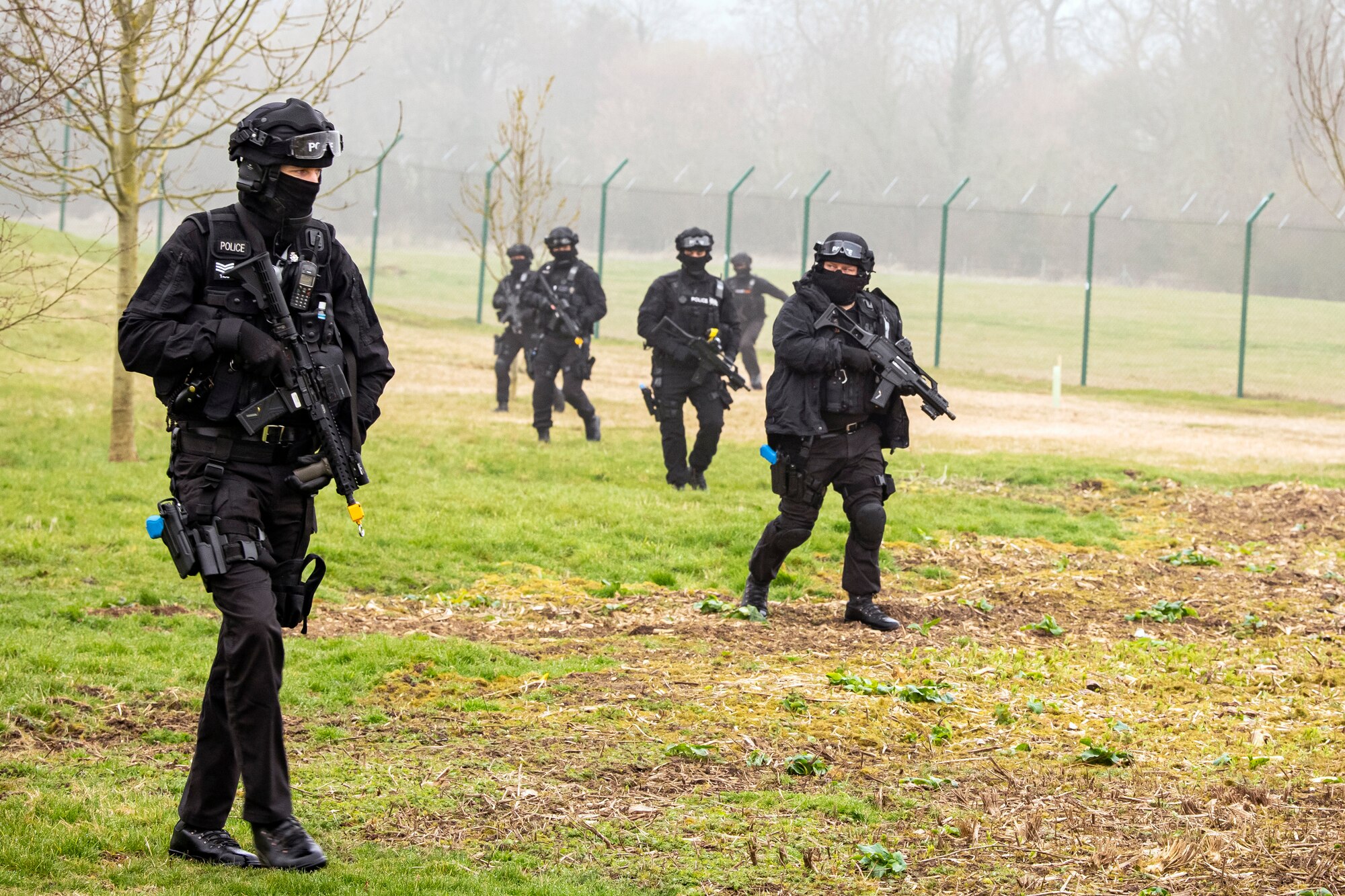 Policemen from the Northamptonshire Police Department conduct a field training exercise at RAF Croughton, England, Mar. 3, 2021. The NHPD utilized the 422d Security Forces Squadron training complex to help strengthen their tactics and techniques. Events like this help strengthen the local partnership between the 422d SFS and the NHPD. (U.S. Air Force photo by Senior Airman Eugene Oliver)