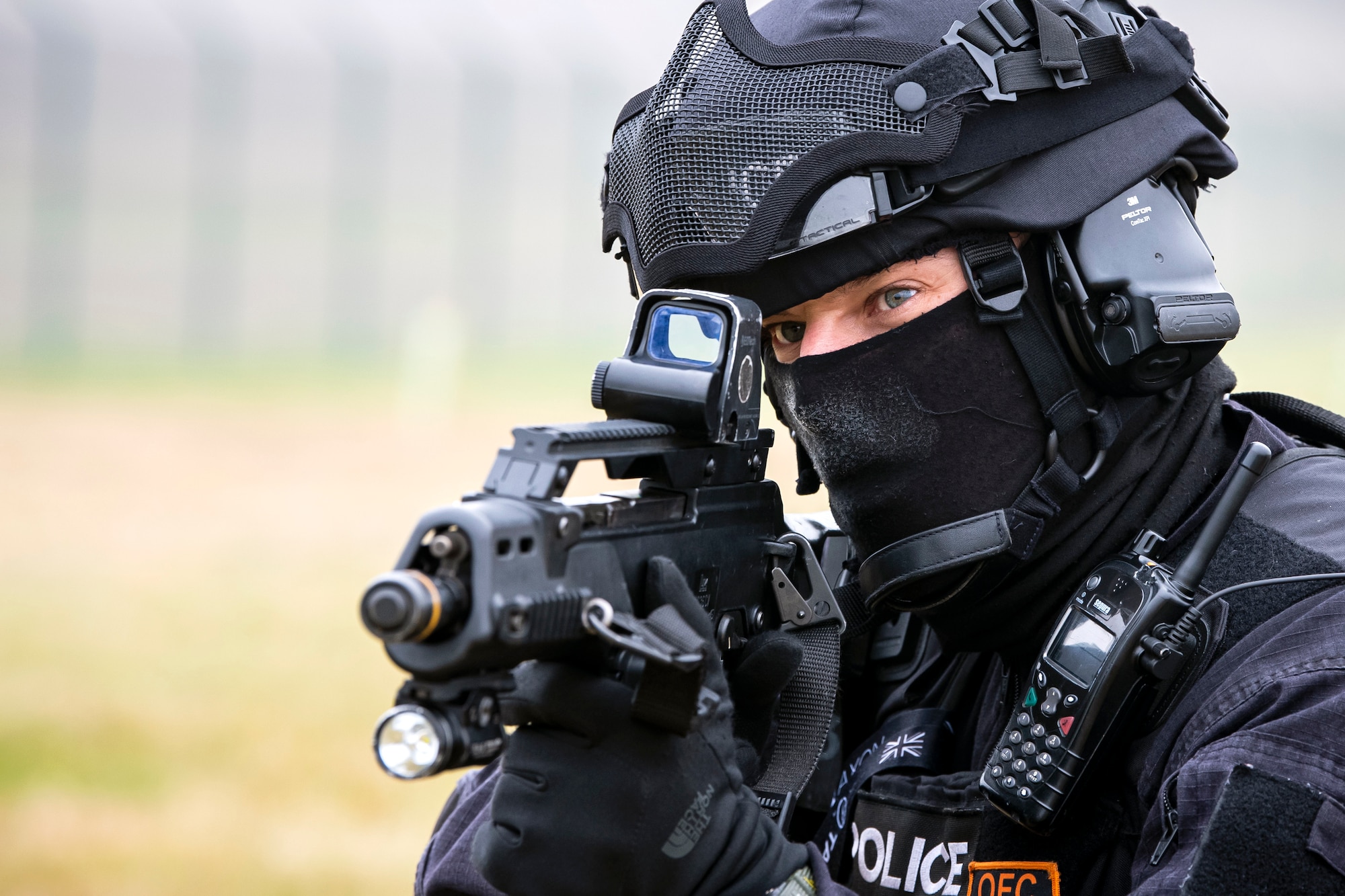 A Policeman from the Northamptonshire Police Department looks down the sight of a G36 Assault Rifle prior to a field training exercise, at RAF Croughton, England, March 3, 2021. The NHPD utilized the 422d Security Forces Squadron training complex to help strengthen their tactics and techniques. Events like this help strengthen the local partnership between the 422d SFS and the NHPD. (U.S. Air Force photo by Senior Airman Eugene Oliver)