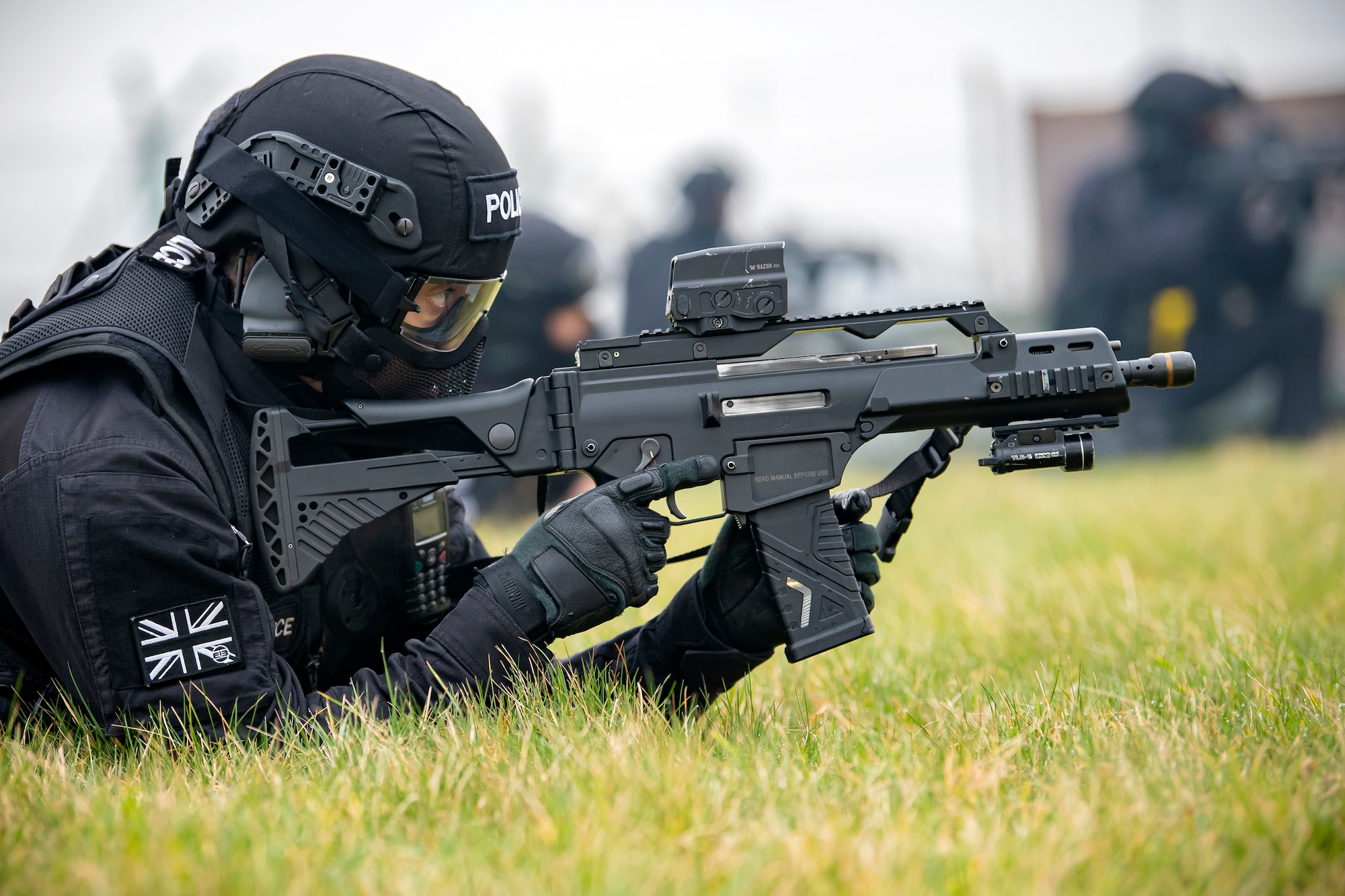 A Policeman from the Northamptonshire Police Department, looks down the sight of a G36 Assault Rifle during a field training exercise at RAF Croughton, England, Mar. 3, 2021. The NHPD utilized the 422d Security Forces Squadron training complex to help strengthen their tactics and techniques. Events like this help strengthen the local partnership between the 422d SFS and the NHPD. (U.S. Air Force photo by Senior Airman Eugene Oliver)