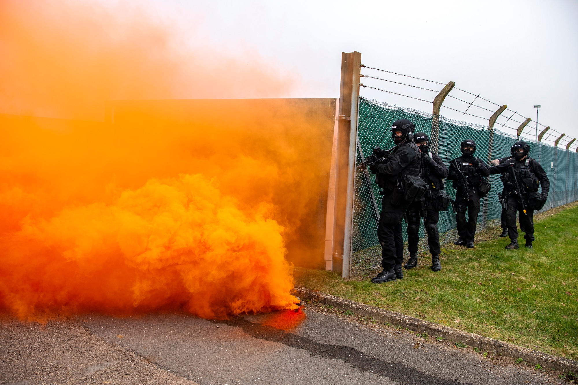 Policemen from the Northamptonshire Police Department, hold their positions during a field training exercise at RAF Croughton, England, Mar. 3, 2021. The NHPD utilized the 422d Security Forces Squadron training complex to help strengthen their tactics and techniques. Events like this help strengthen the local partnership between the 422d SFS and the NHPD. (U.S. Air Force photo by Senior Airman Eugene Oliver)