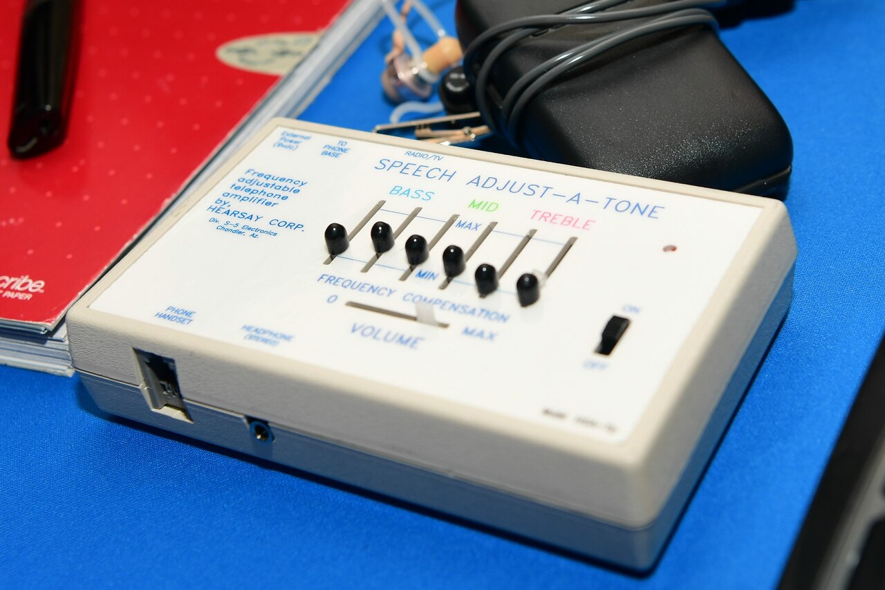 A device with six small levers sits on a table.