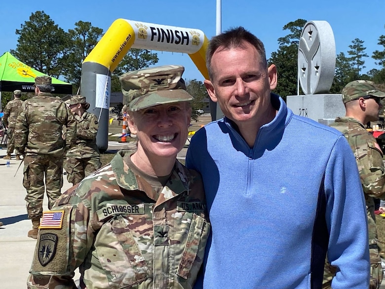 U.S. Army Engineer Research and Development Center Commander Col. Teresa Schlosser and spouse, Tim Cutler, pose for a picture after completing the 18.6-mile Norwegian Foot March/Run at Camp Shelby Joint Forces Training Center, near Hattiesburg, Miss., March 6, 2021. Schlosser was recognized for an exceptional completion time for the march, and Cutler earned first place in the 18.6-mile trail run. (U.S. Army Corps of Engineers photo)