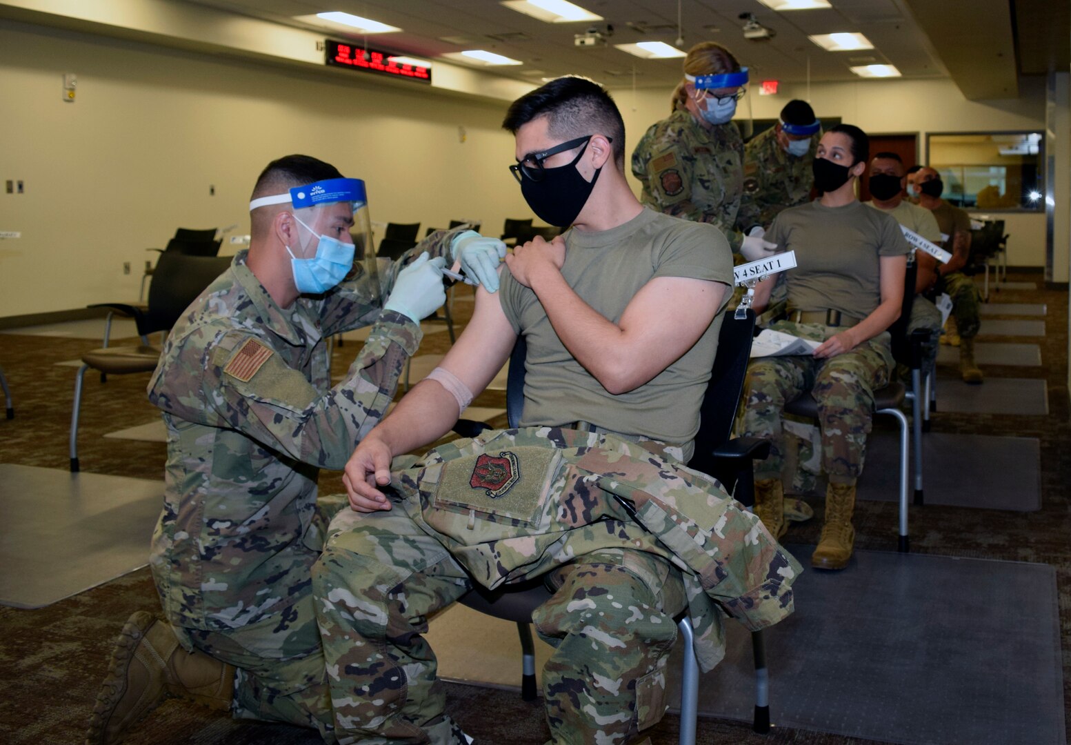 Reserve Citizen Airmen with the 433rd Airlift Wing receive their COVID-19 vaccines, March 6, 2021 at Joint Base San Antonio-Lackland, Texas. The wing had 600 doses available for those wanting to be vaccinated. (U.S. Air Force photo by Senior Airman Brittany Wich)