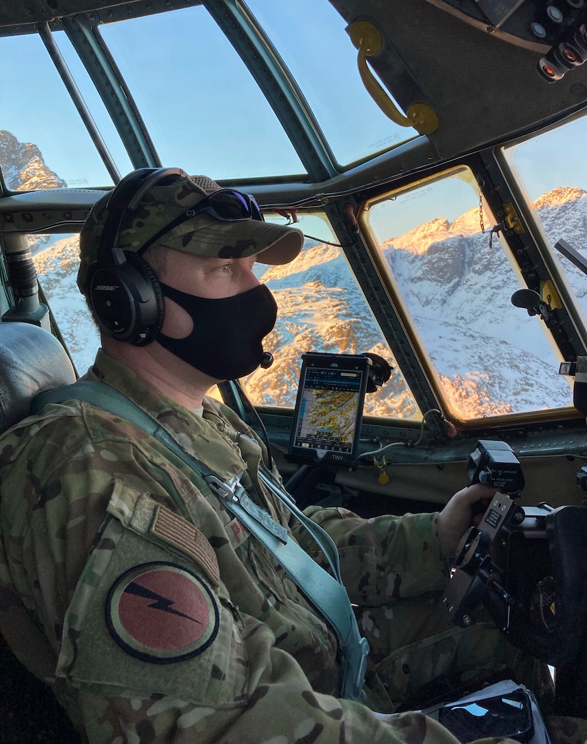 U.S. Air Force Lt. Col. Josh Panis, 118th Airlift Squadron assistant director of operations and mission aircraft commander, flies a C-130H Hercules over Greenland Feb. 10, 2021. The 103rd Airlift Wing transported 12 National Science Foundation personnel and their equipment from Stratton Air National Guard Base in Scotia, New York, to Kangerlussuaq, Greenland, for the beginning of their annual climate research mission at Greenland’s ice cap.
