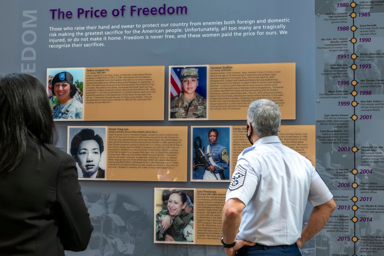 Visitors tour a museum exhibit.