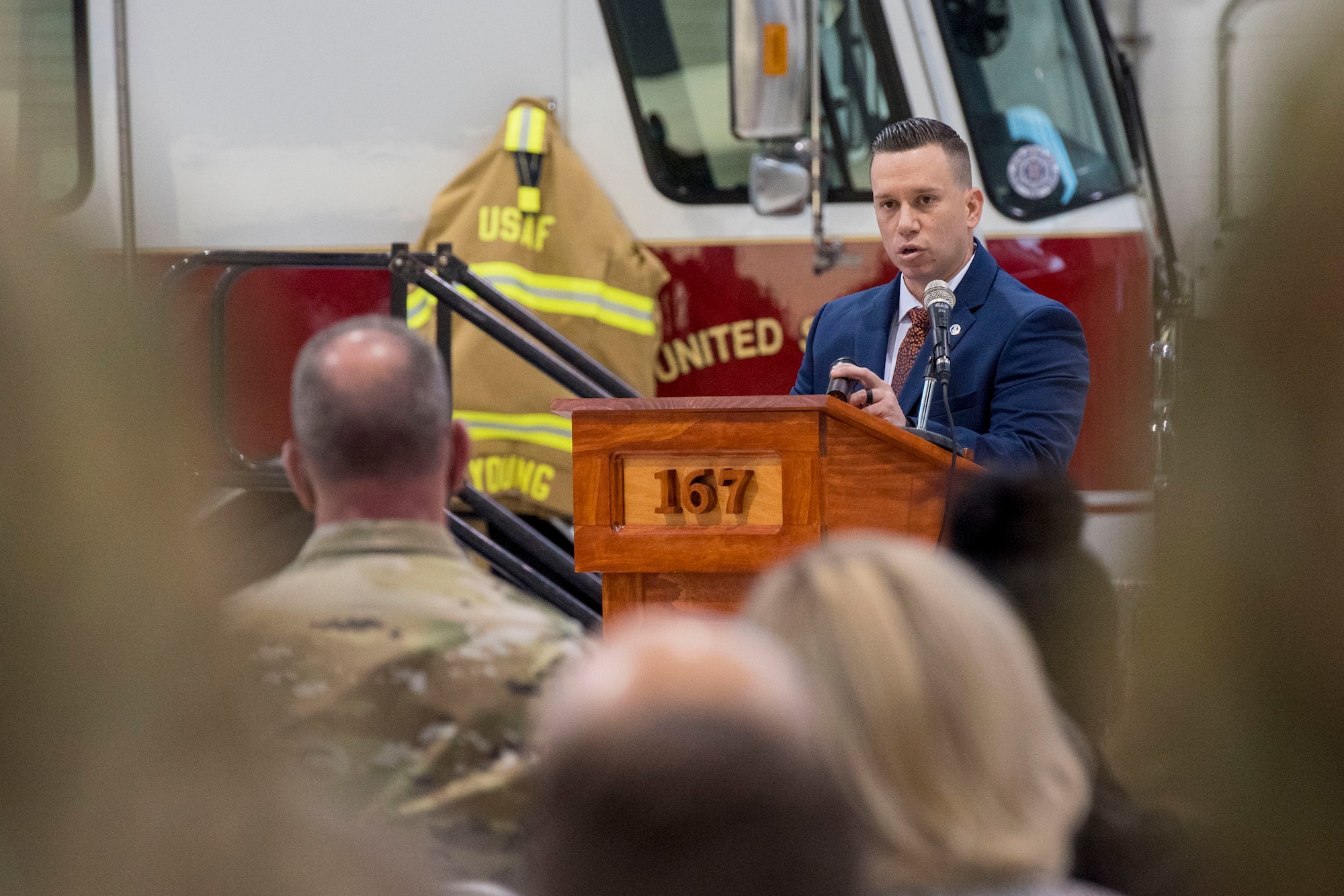 U.S. Air Force Tech. Sgt. Brandon Spears delivers a eulogy for Staff Sgt. Logan Young during a memorial service held at the 167th Airlift Wing, Shepherd Field, Martinsburg, West Virginia, March 6, 2021. Spears and Logan and become friends while serving together at two different active duty stations.