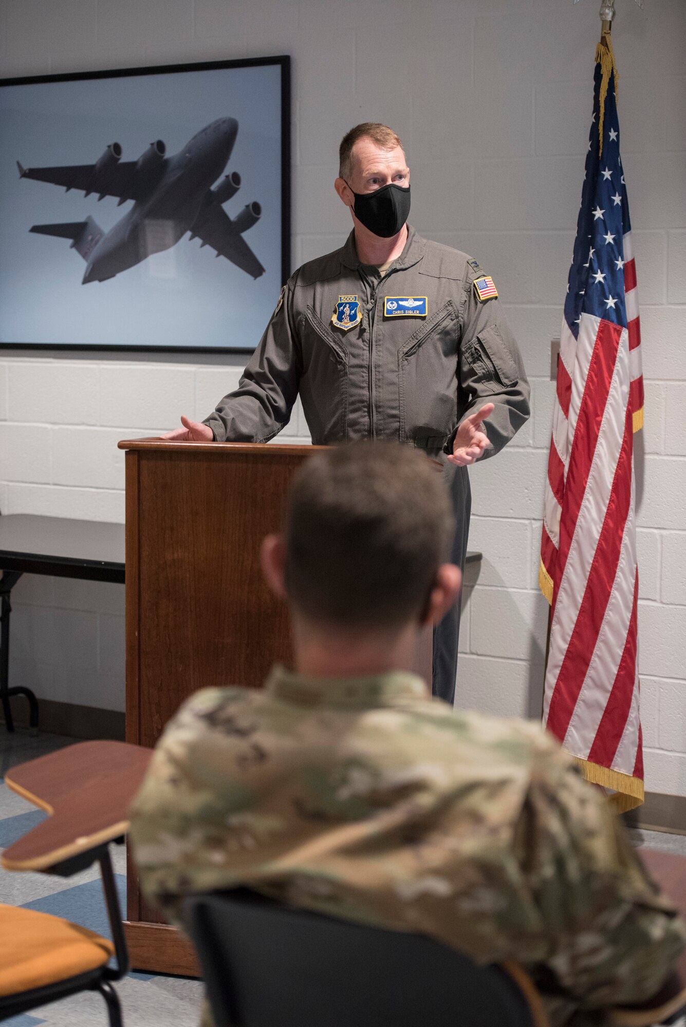 U.S. Air Force Col. Chris Sigler, commander, 167th Operations Group, 167th Airlift Wing, West Virginia National Guard, briefs Lt. Gen. Michael A. Loh, director, Air National Guard, on recent airlift operations at Shepherd Field Air National Guard Base in Martinsburg, West Viriginia., March 9, 2021. During his visit, Loh received updates on the unit’s current operations and response to the COVID-19 pandemic