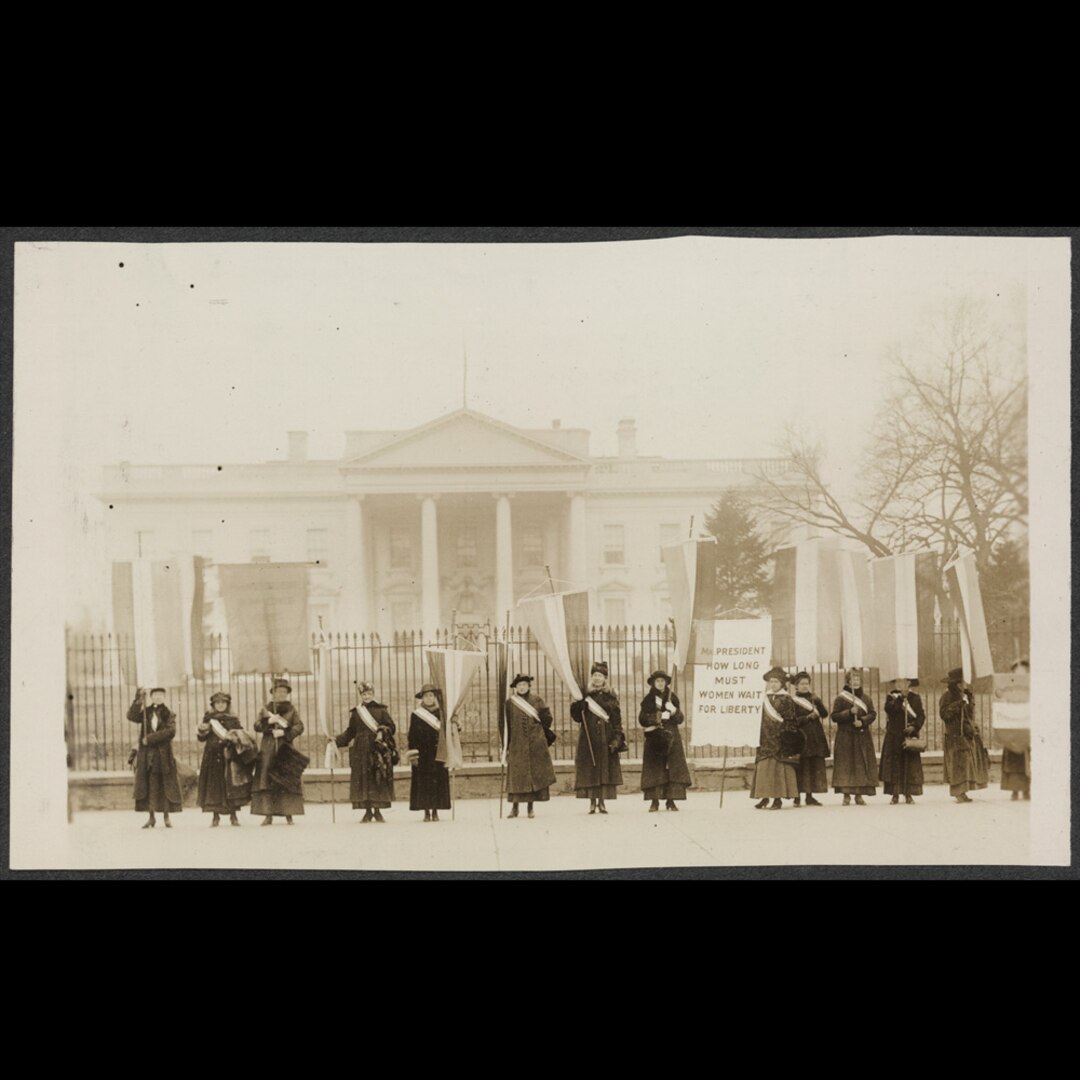 A group of suffragists protest in front of the White House in 1917.