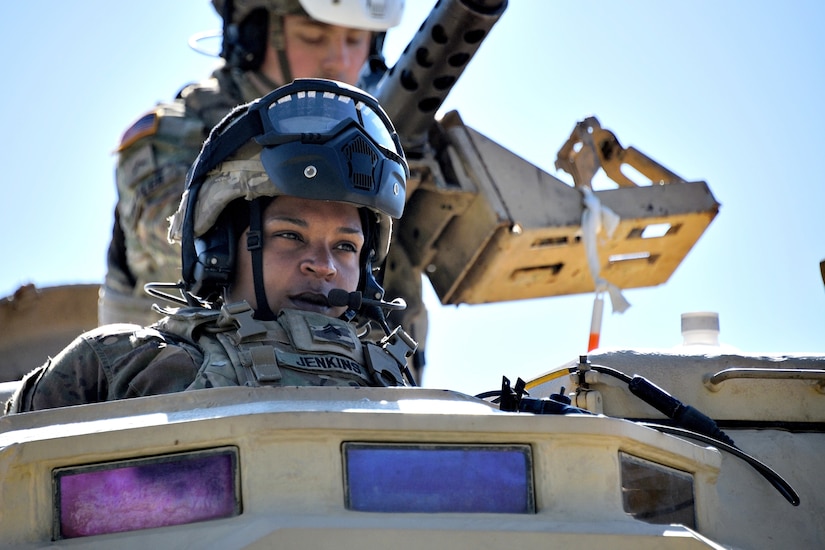 A women sits in a turret