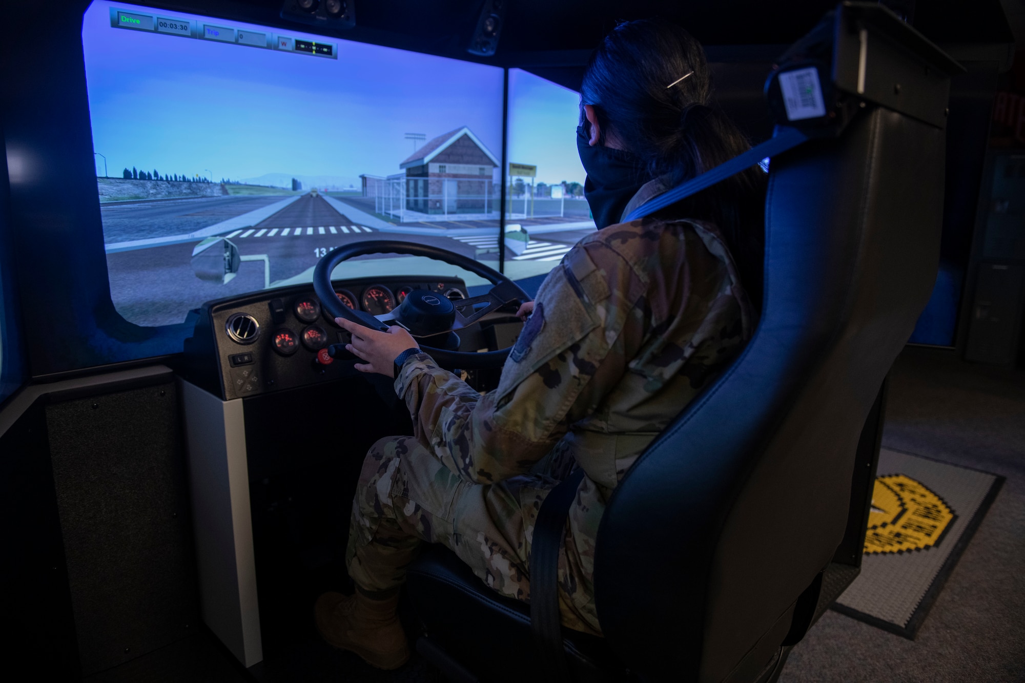 Woman drives a simulated truck
