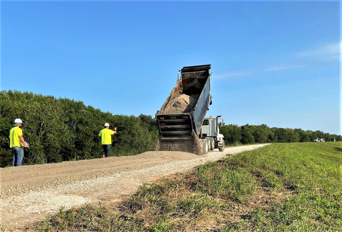 IN THE PHOTO, A Rock Construction works to resurface the levee crown near Phillips County, Arkansas. 2019 flood damage supplemental funds funded the project.