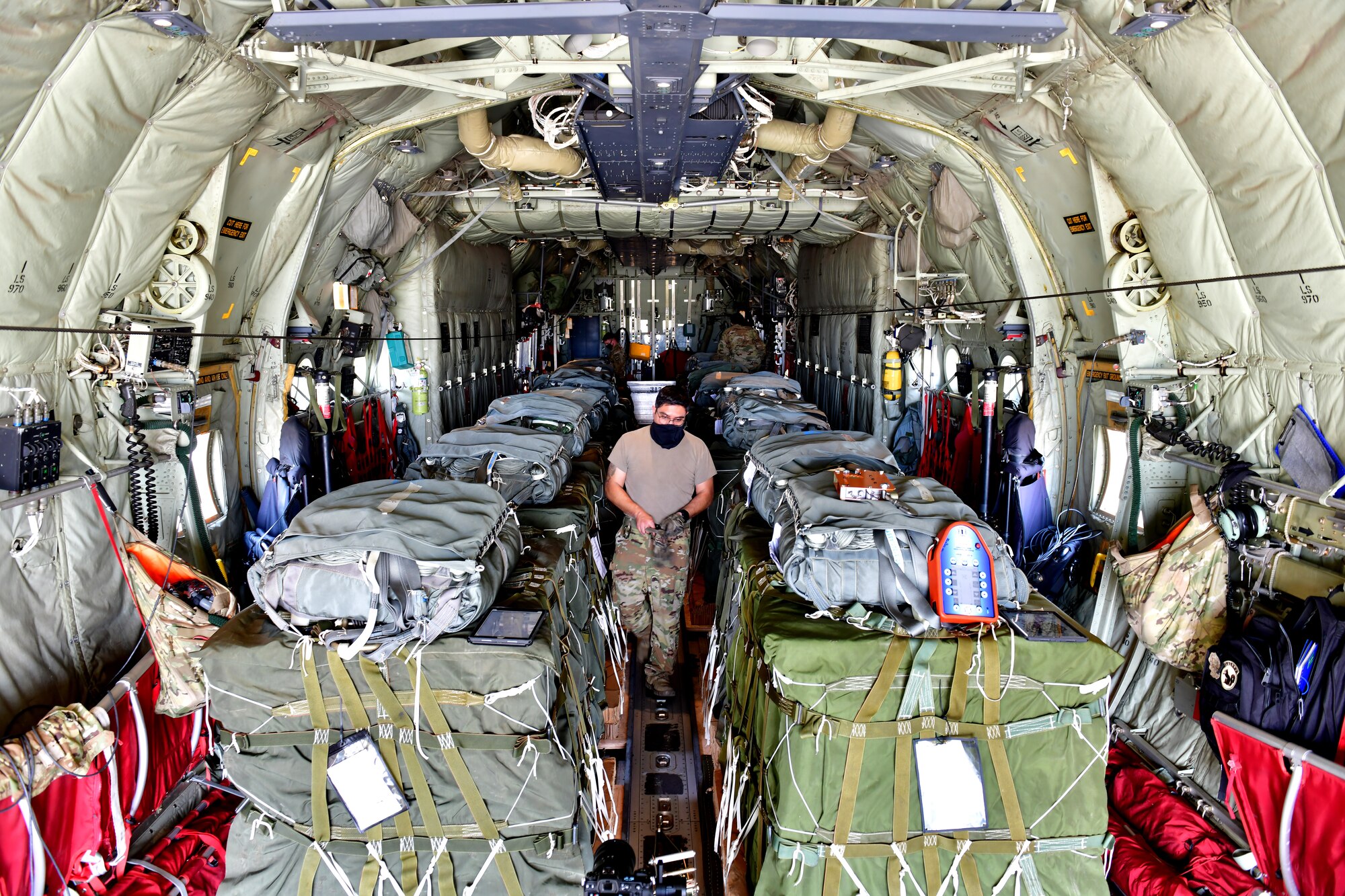 A person checks pallet bundles