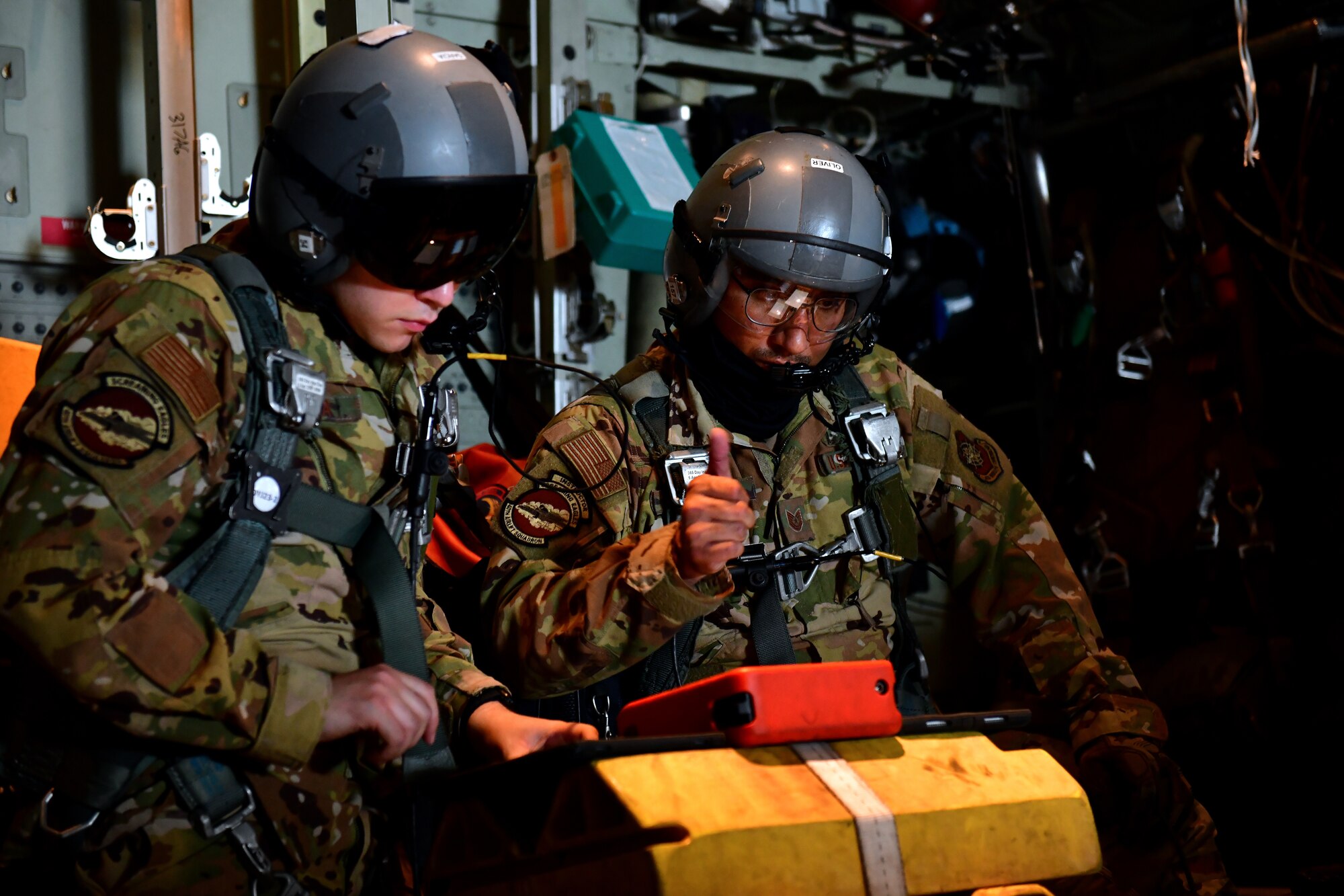 Two people sit in an aircraft