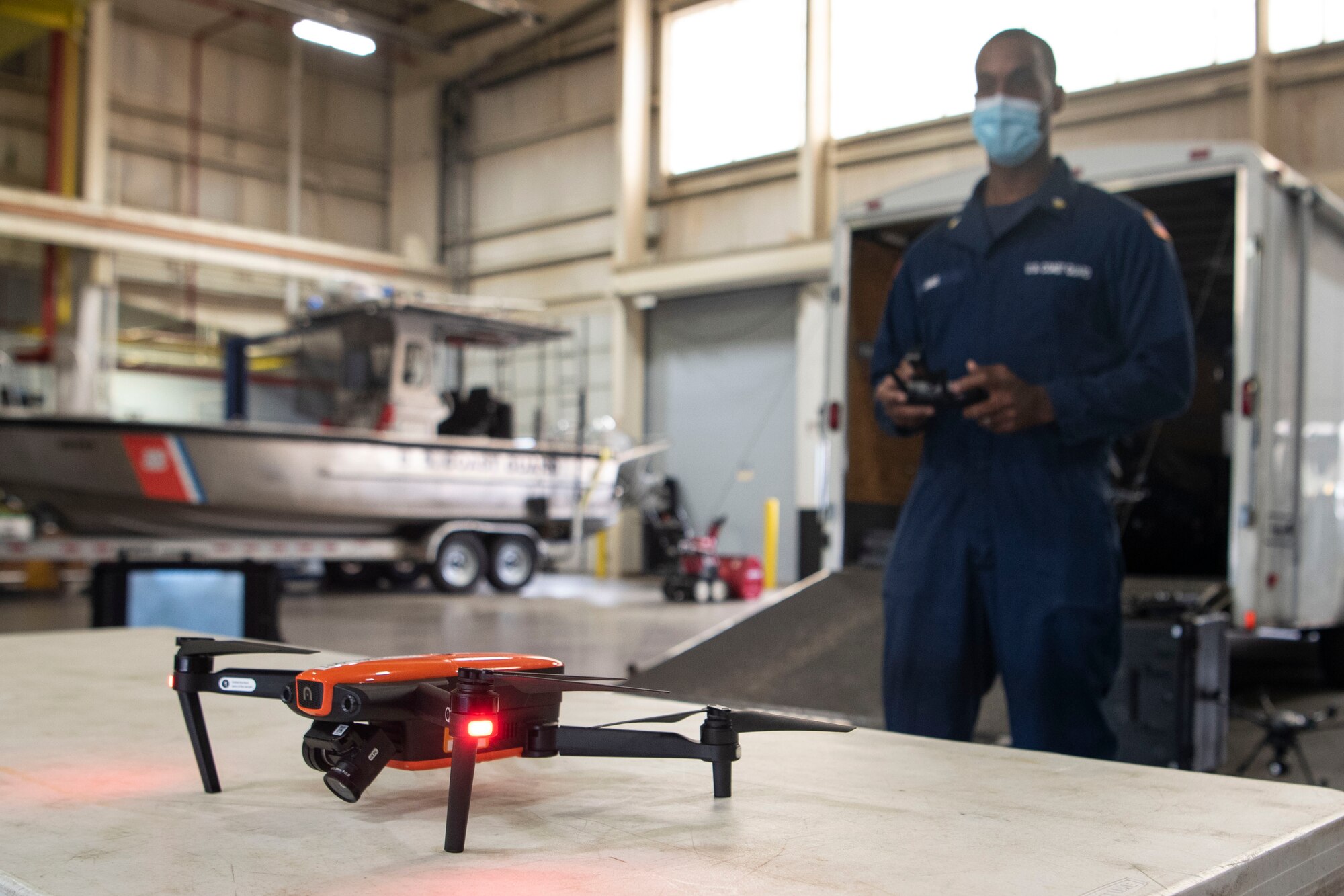 Photo of a U.S. Coast Guard Atlantic Strike Team member using a drone.