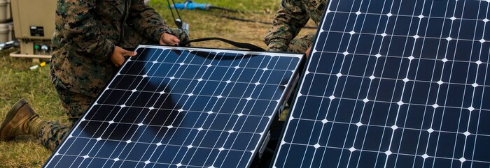 Sgt. Antonio M. Garay, right, conducts a routine maintenance check on the solar panels for the Ground Renewable Expeditionary Energy System with Lance Cpl. Ruben Moralessoto, left, as Lance Cpl. Angel Servin provides another set of eyes Nov. 4 during exercise Blue Chromite 15 on Camp Schwab. The solar panels require five to 15 minutes to check and set up and require basic knowledge of the systems to operate and maintain. The Marines maintaining the systems are with Communications Platoon, Headquarters and Service Battalion, 4th Marine Regiment, 3rd Marine Division, III Marine Expeditionary Force. Garay is from Tuscon, Arizona. Moralessoto is from Moca, Puerto Rico. Servin is from San Bernardino, California. (U.S. Marine Corps photo by Lance Cpl. Tyler S. Giguere/Released)
