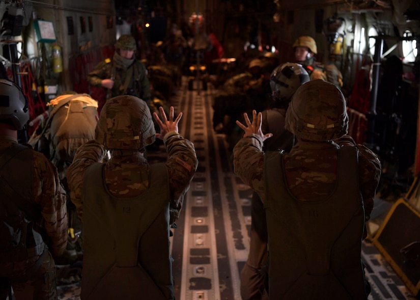 U.S. and Japanese soldiers get the word that their jump from a C-130 is in 10 minutes.