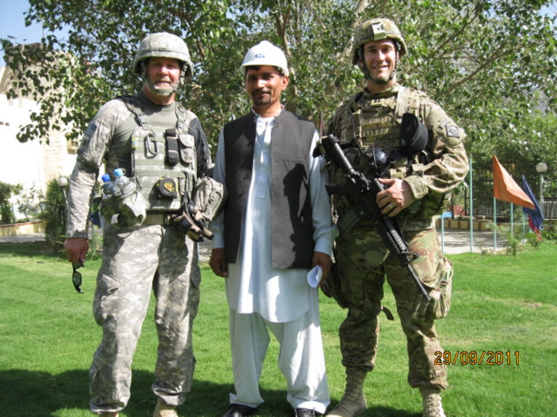 U.S. Army Corps of Engineers Construction Representative Robert Woodall and then Capt. Daniel J. Fox pose with a local contractor construction foreman during a site visit to the Torkham Gate border crossing project in Nangarhar, Afghanistan Sept. 29, 2011, during Fox’s time deployed to Afghanistan in support of the U.S. Army Corps of Engineers, Transatlantic Division. Recently promoted to lieutenant colonel, Fox now serves as the Deputy District Commander of the U.S. Army Corps of Engineers, Europe District. (Courtesy Photo)